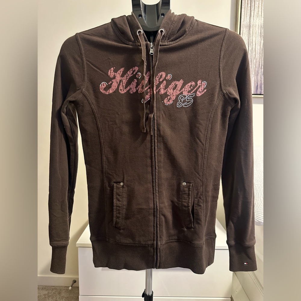 Tommy Hilfiger women's brown full-zip hoodie features a rhinestone-accented.
